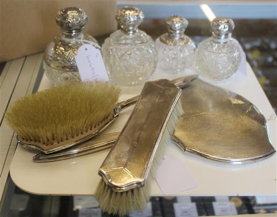 Silver three-piece dressing table set and four scent bottles